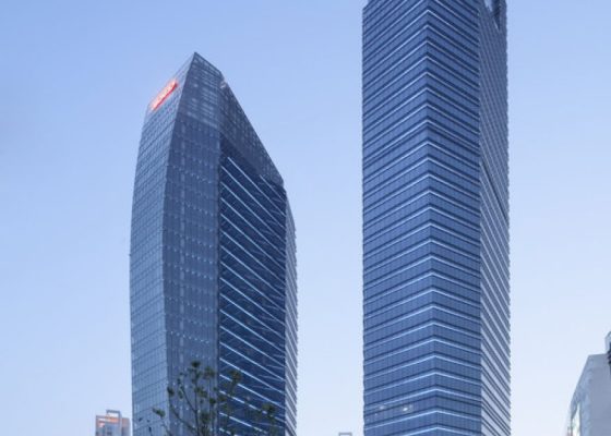 This project won the first prize in the international competition against some of the world biggest architecture companies. Those two skyscrapers are located in a new district of Suzhou and will become a landmark of the area. Project is featuring two skyscrapers. The ofﬁce building is 214 m high and a service apartment building 130 m high. The skyscrapers are opening up towards the intersection creating a plaza in between. It’s kind of a funnel leading people trough the passage with the retail towards the park. The skyscrapers are connected with a platform featuring coffee shops and restaurants. Sunken garden with waterfall offer an easy access to the subway system. Space covered by roof can be used as an outside show room. There is also a hypermarket located in the basement easily accessible from the subway station.